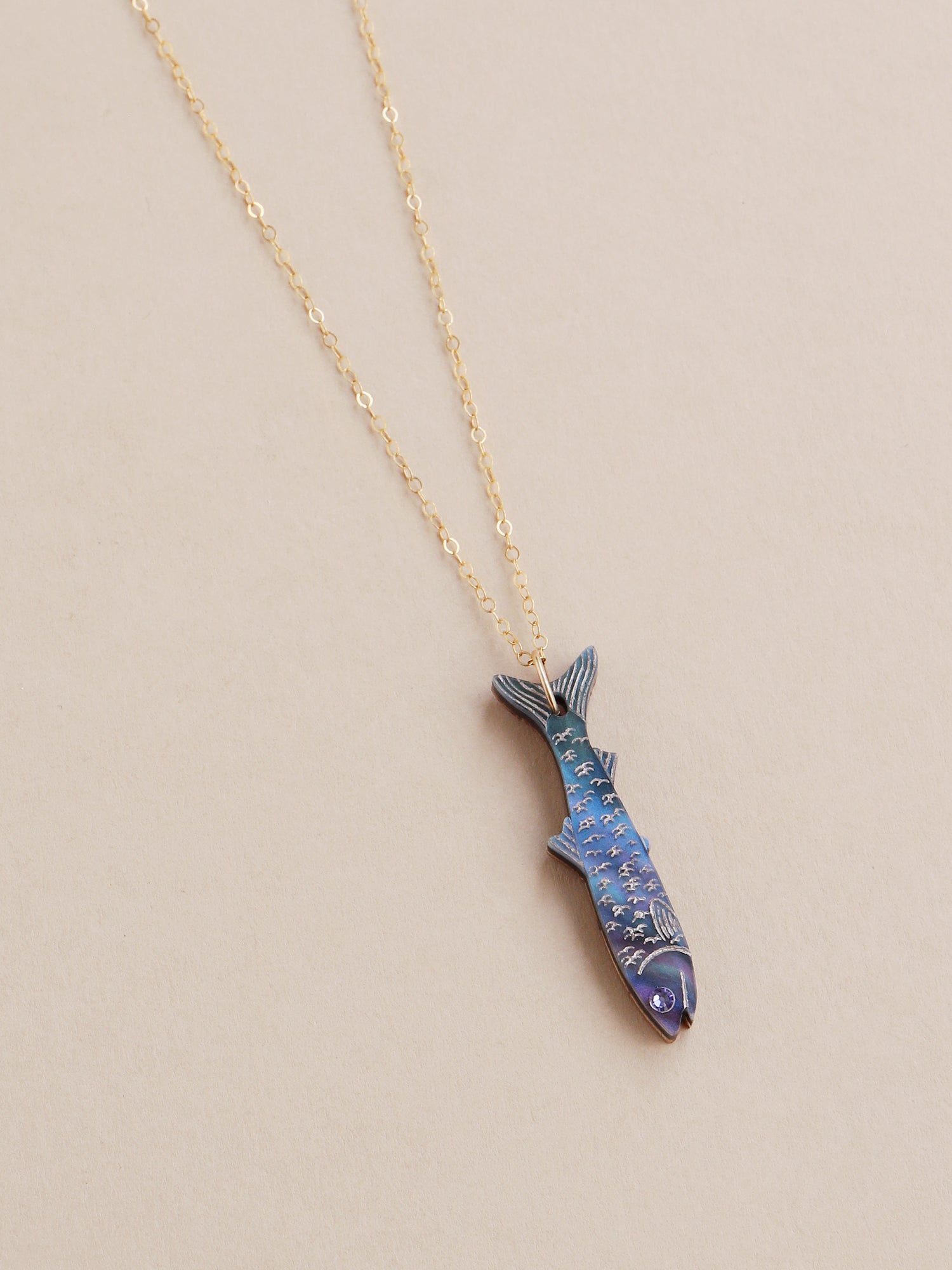 Blue anchovy necklace. Made from acrylic with high quality glass crystals and 14k gold-filled findings & chain. Handmade in the UK by Wolf & Moon.
