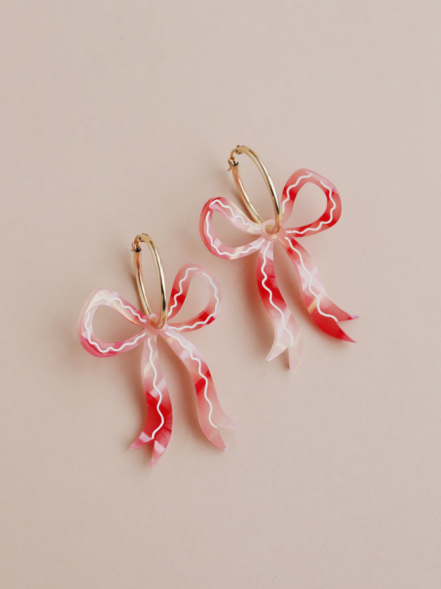 Gingham bow hoop earrings. Made from acrylic with hand-inked details and 14k gold-filled hoops. Handmade in the UK by Wolf & Moon.