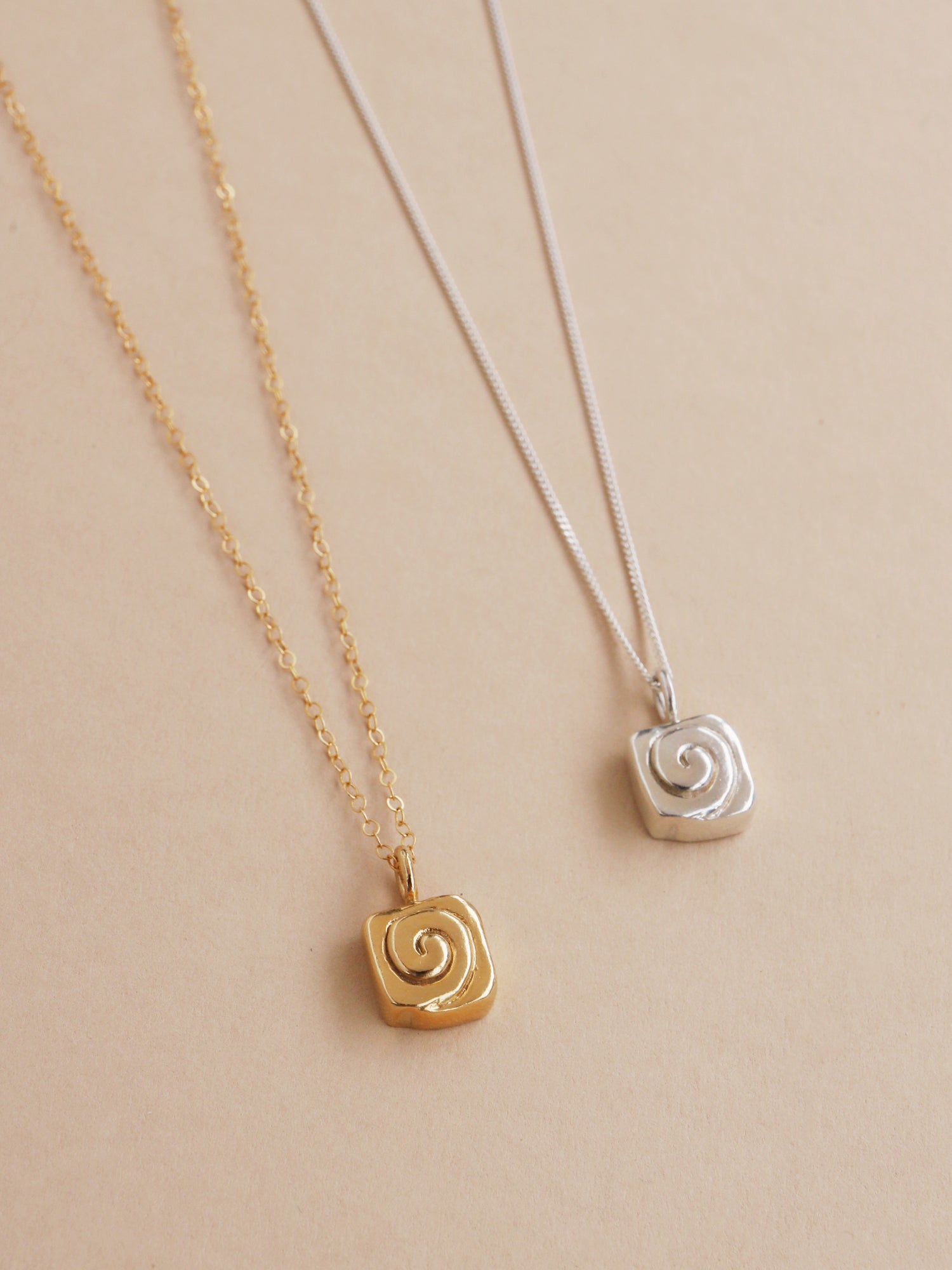 Cinnamon bun necklace. Made from recycled sterling silver with optional 24k gold-plated vermeil. Handmade in the UK by Wolf & Moon.