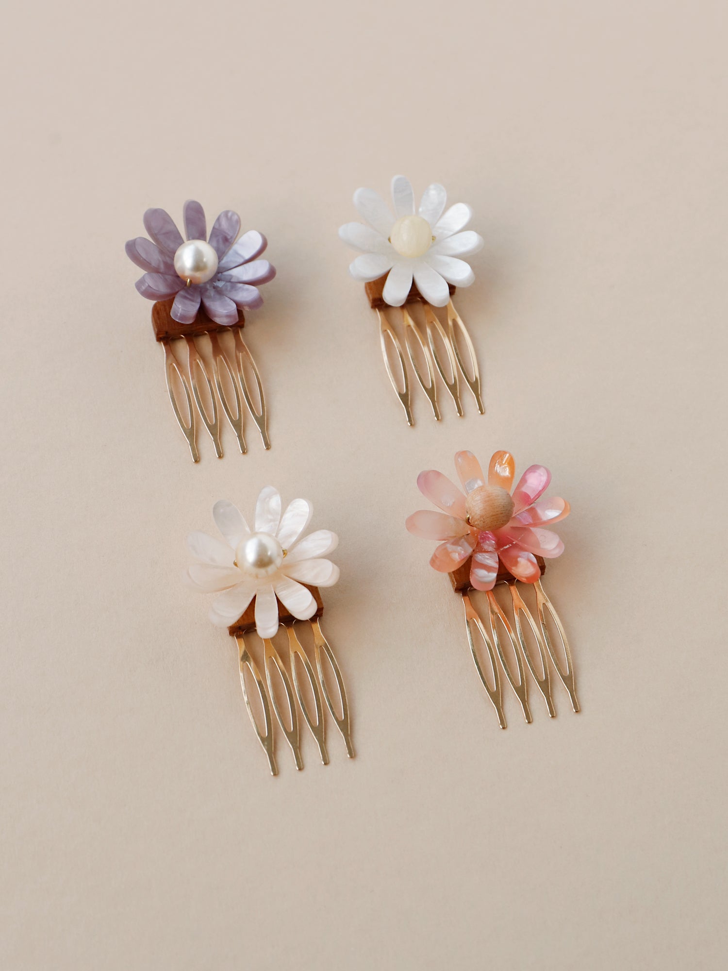 Hand-formed flower acrylic hair comb. Made with acrylic and a gold-tone or black metal hair comb. Handmade in the UK by Wolf & Moon.