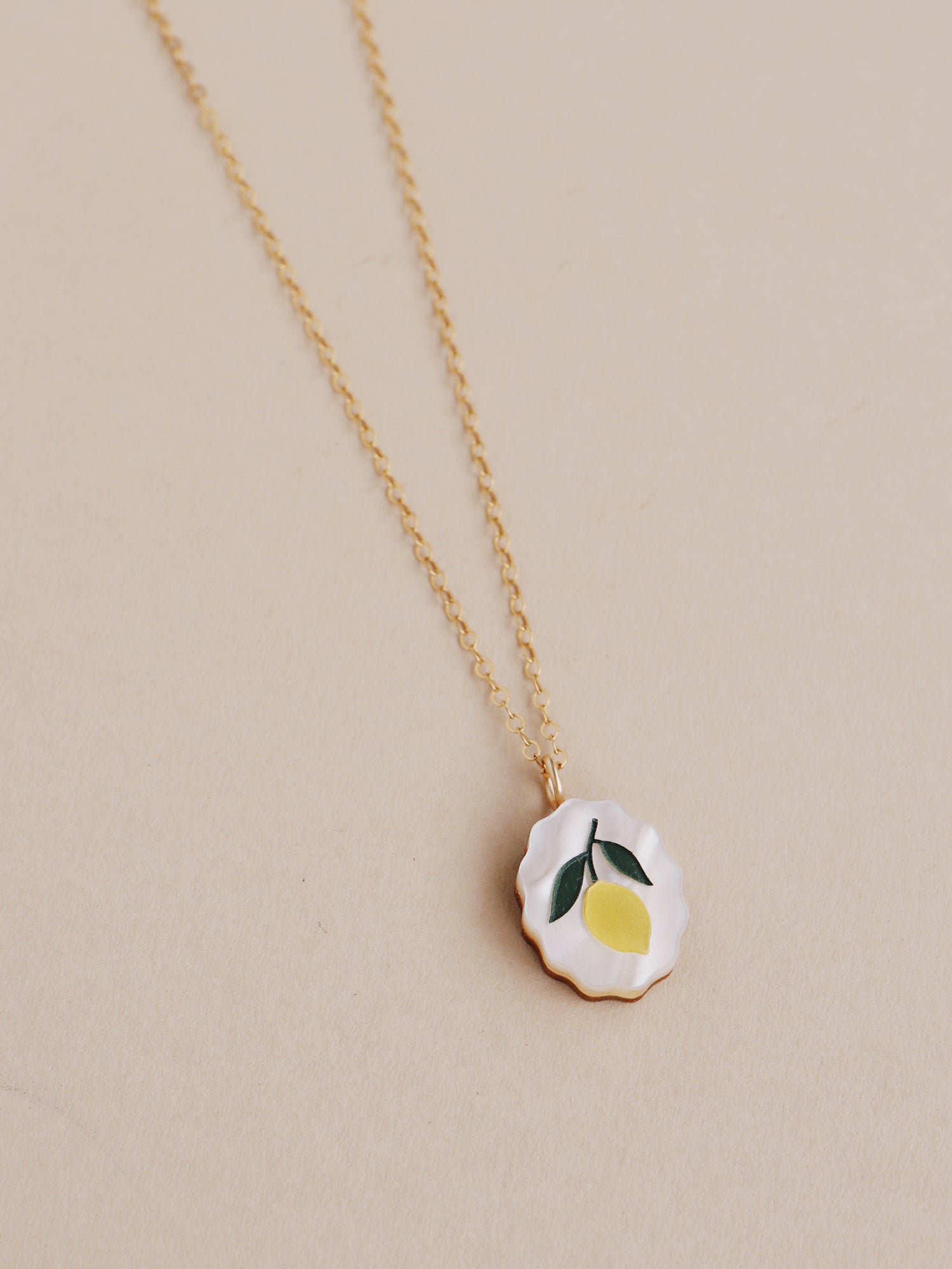 Lemon charm necklace made from acrylic and a 14k gold-filled chain & findings. Handmade in the UK by Wolf & Moon.