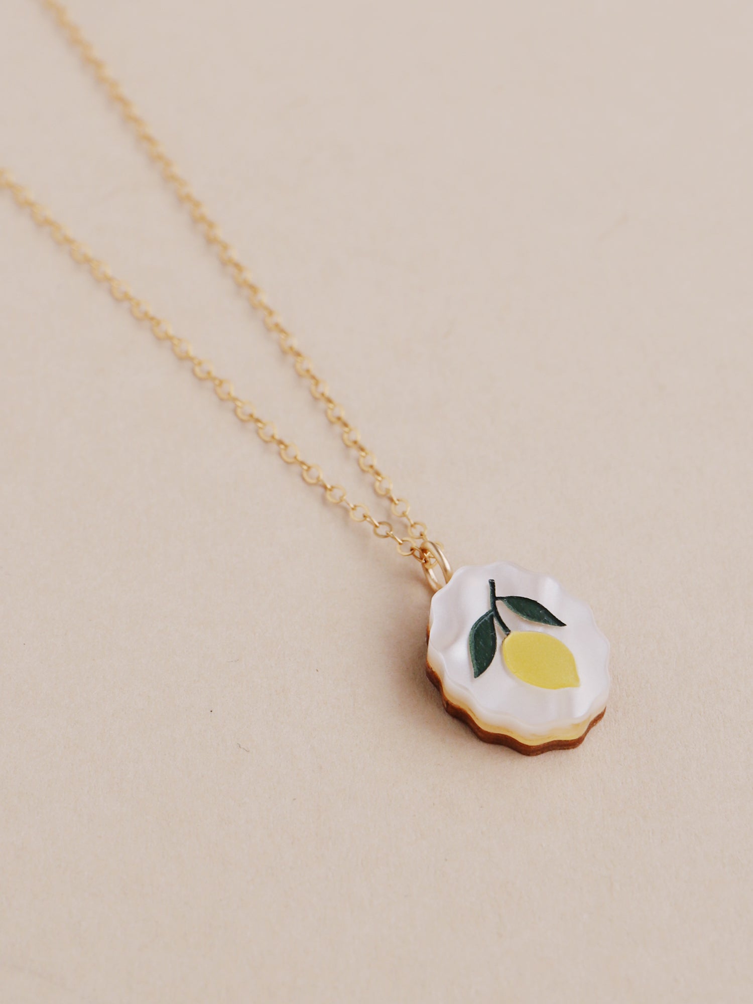Lemon charm necklace made from acrylic and a 14k gold-filled chain & findings. Handmade in the UK by Wolf & Moon.
