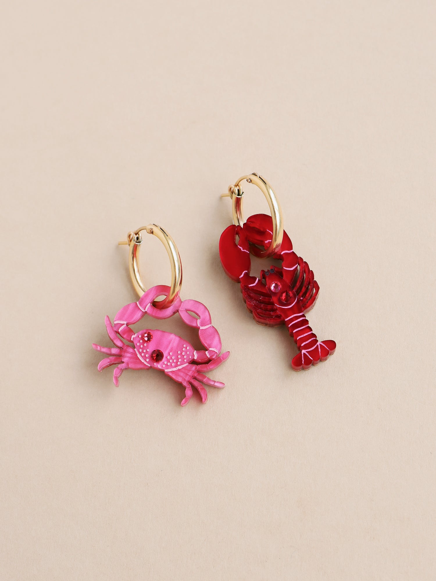 Red lobster and pink crab mix and match hoop earrings. Made from acrylic with high quality glass crystals and 14k gold-filled findings & hoops. Handmade in the UK by Wolf & Moon.