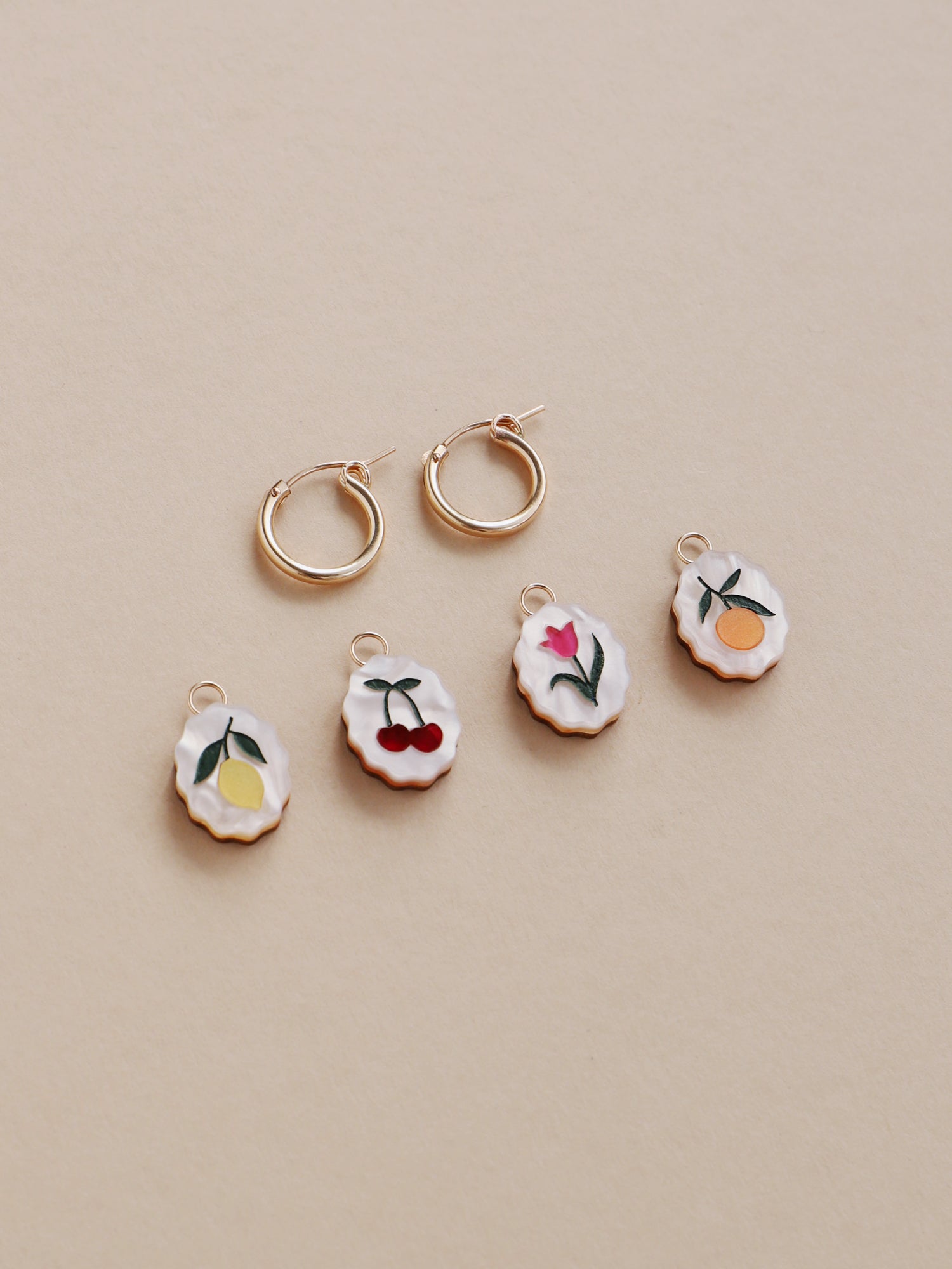 Lemon, cherry, tulip & orange mix n’ match charm hoop earrings. Made from acrylic and 14k gold-filled hoops & findings. Handmade in the UK by Wolf & Moon.