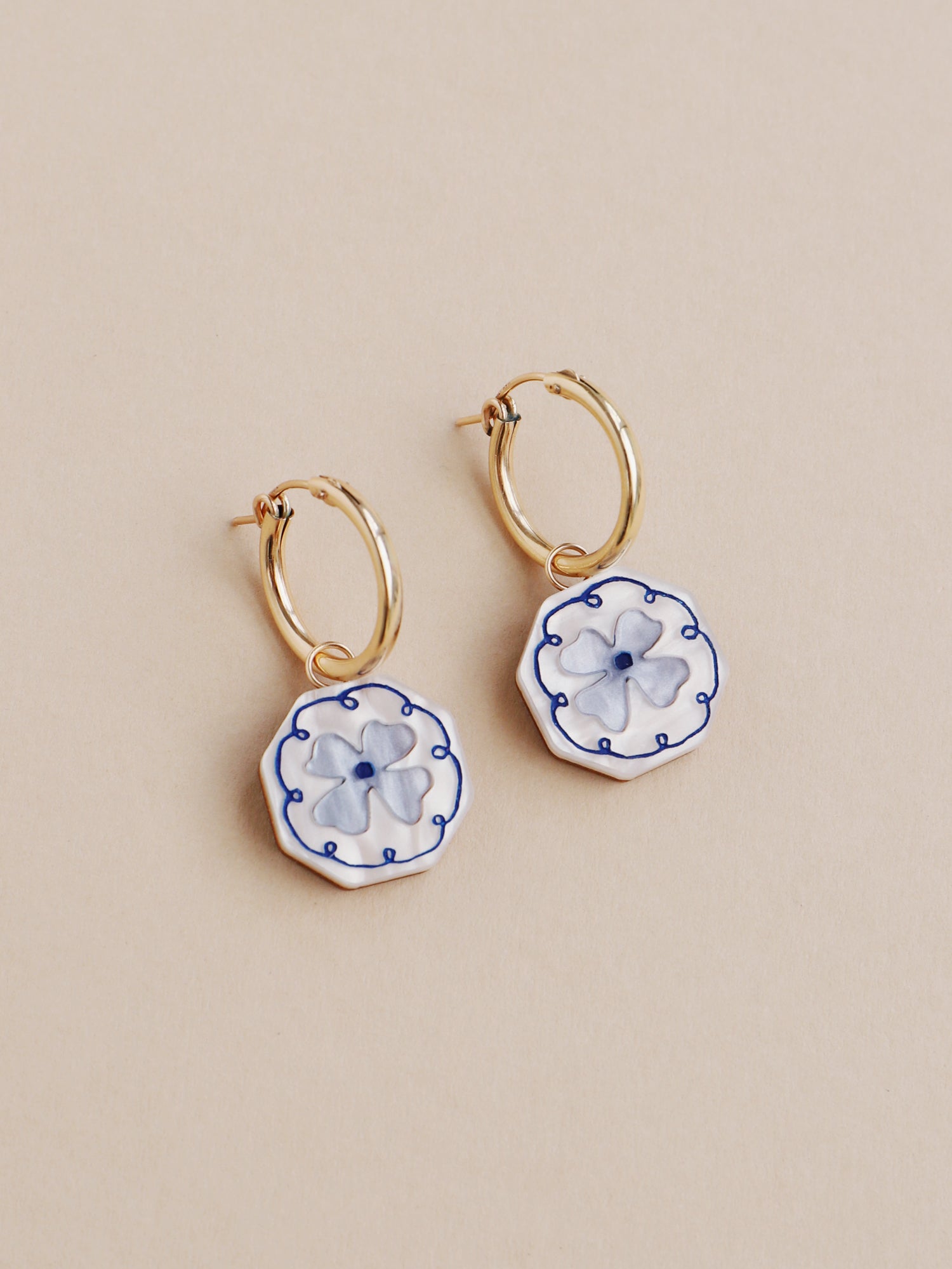 Blue and white poppy charm hoop earrings. Made from acrylic and 14k gold-filled hoops & findings.  Handmade in the UK by Wolf & Moon.