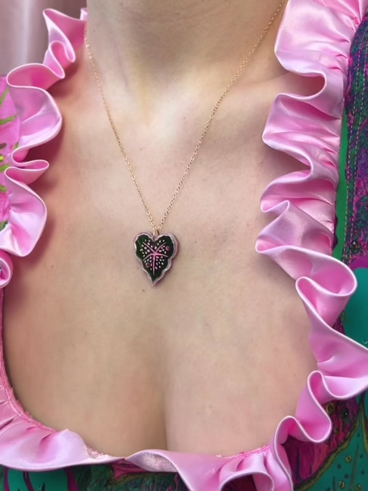 Heart-shaped caladium leaf necklace. A design collaboration with L.O.M, a colourful party-wear brand. Handmade in the UK by Wolf & Moon.