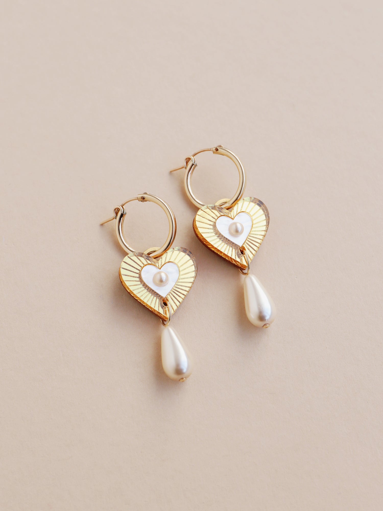Cream & gold heart hoop earrings. Made from acrylic with high quality glass pearl details and 14k gold-filled findings & hoops. Handmade in the UK by Wolf & Moon.