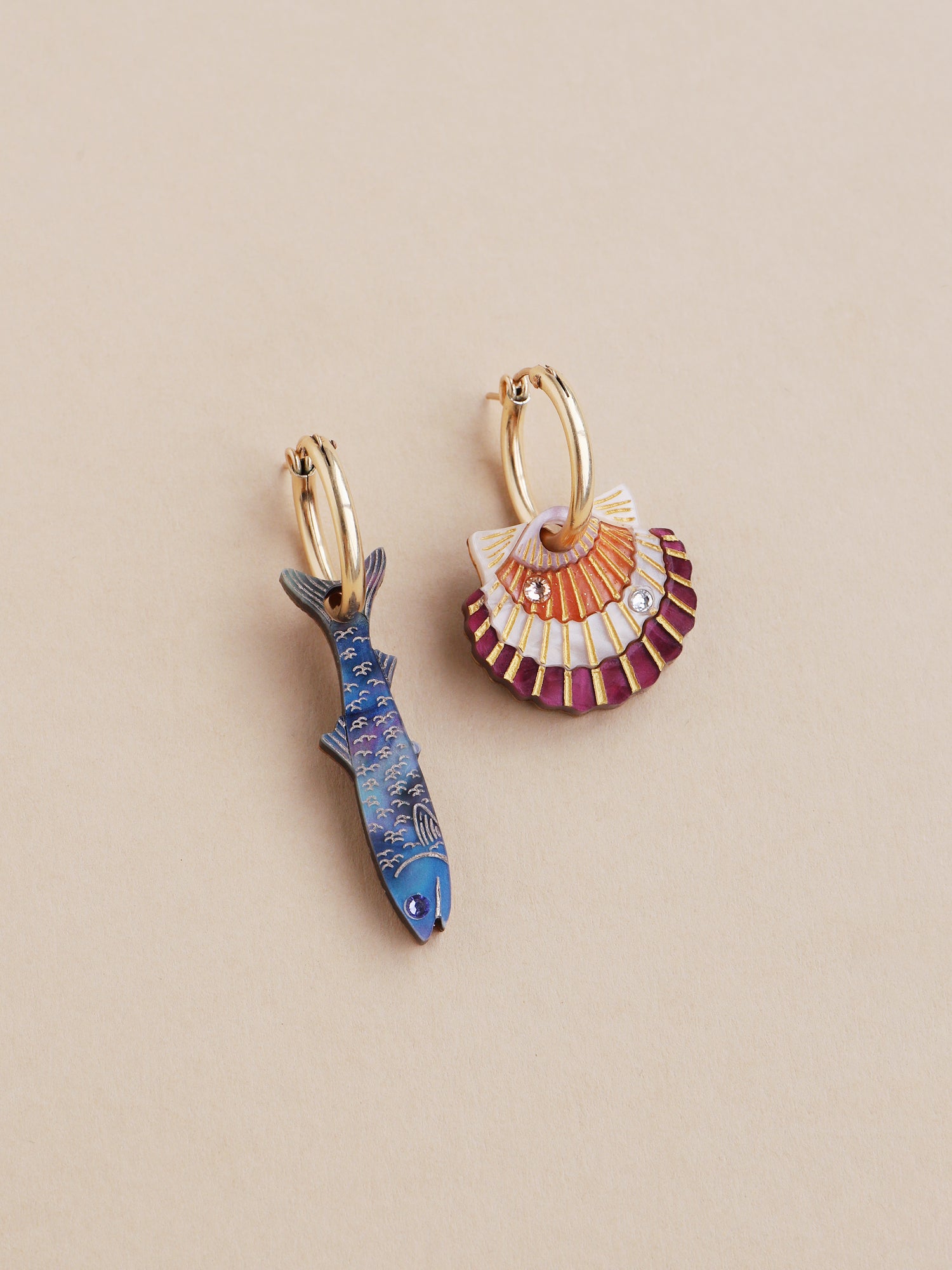 Blue anchovy & peach and cream scallop shell mix and match hoop earrings. Made from acrylic with high quality glass crystals and 14k gold-filled findings & hoops. Handmade in the UK by Wolf & Moon.
