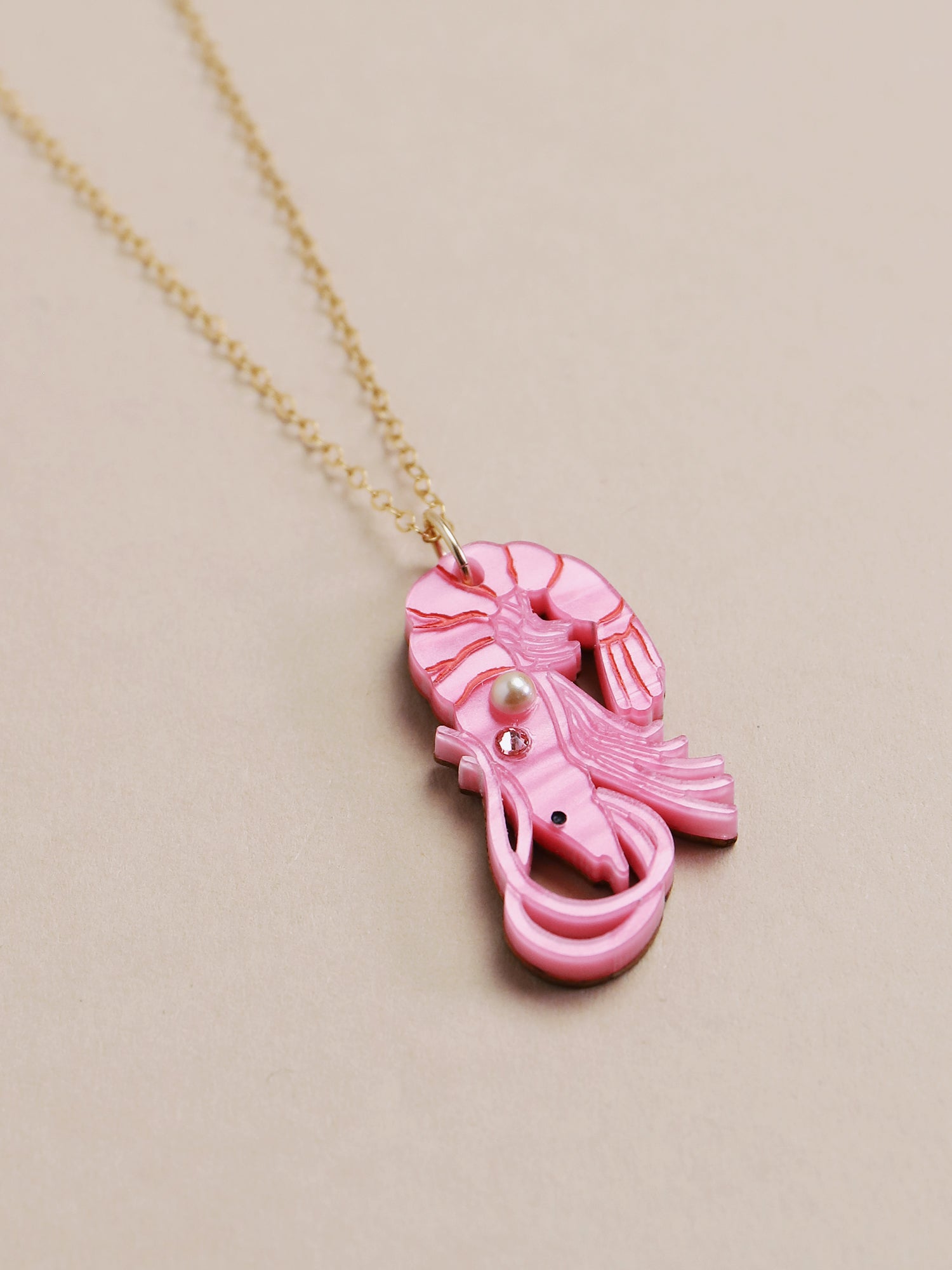 Pink shrimp necklace. Made from acrylic with high quality glass crystals & pearls with a 14k gold-filled chain. Handmade in the UK by Wolf & Moon.
