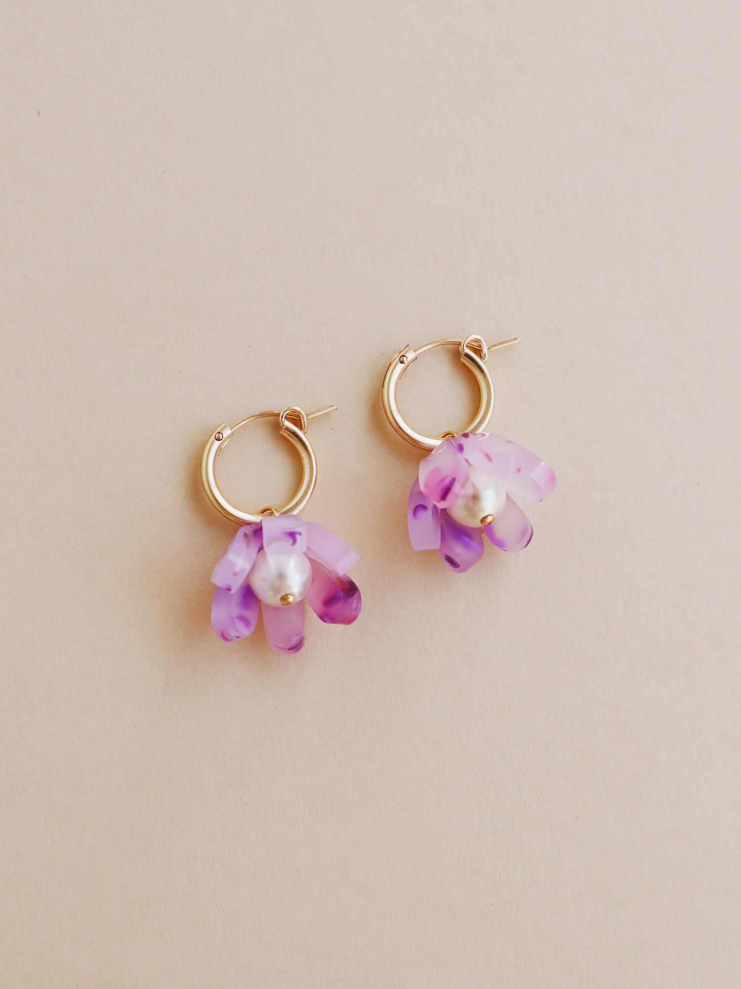 Purple, sculptural tulip hoop earrings. Made from heat-formed acrylic with high quality glass pearls and 14k gold-filled findings. Handmade in the UK by Wolf & Moon.