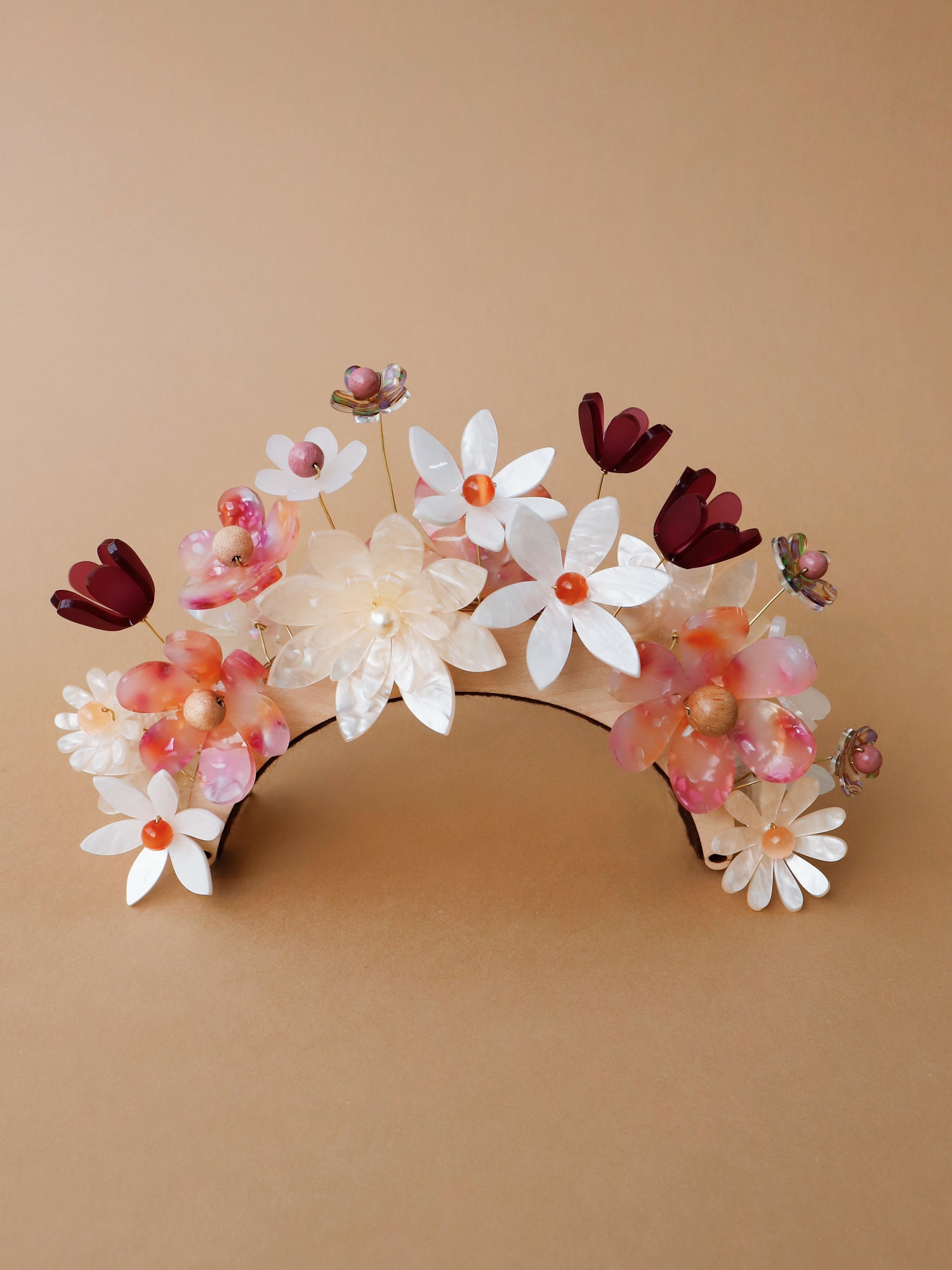 Hand-formed flower acrylic headpiece. Made from acrylic, FSC approved wood with gold-tone or black metal hair combs. Handmade in the UK by Wolf & Moon.