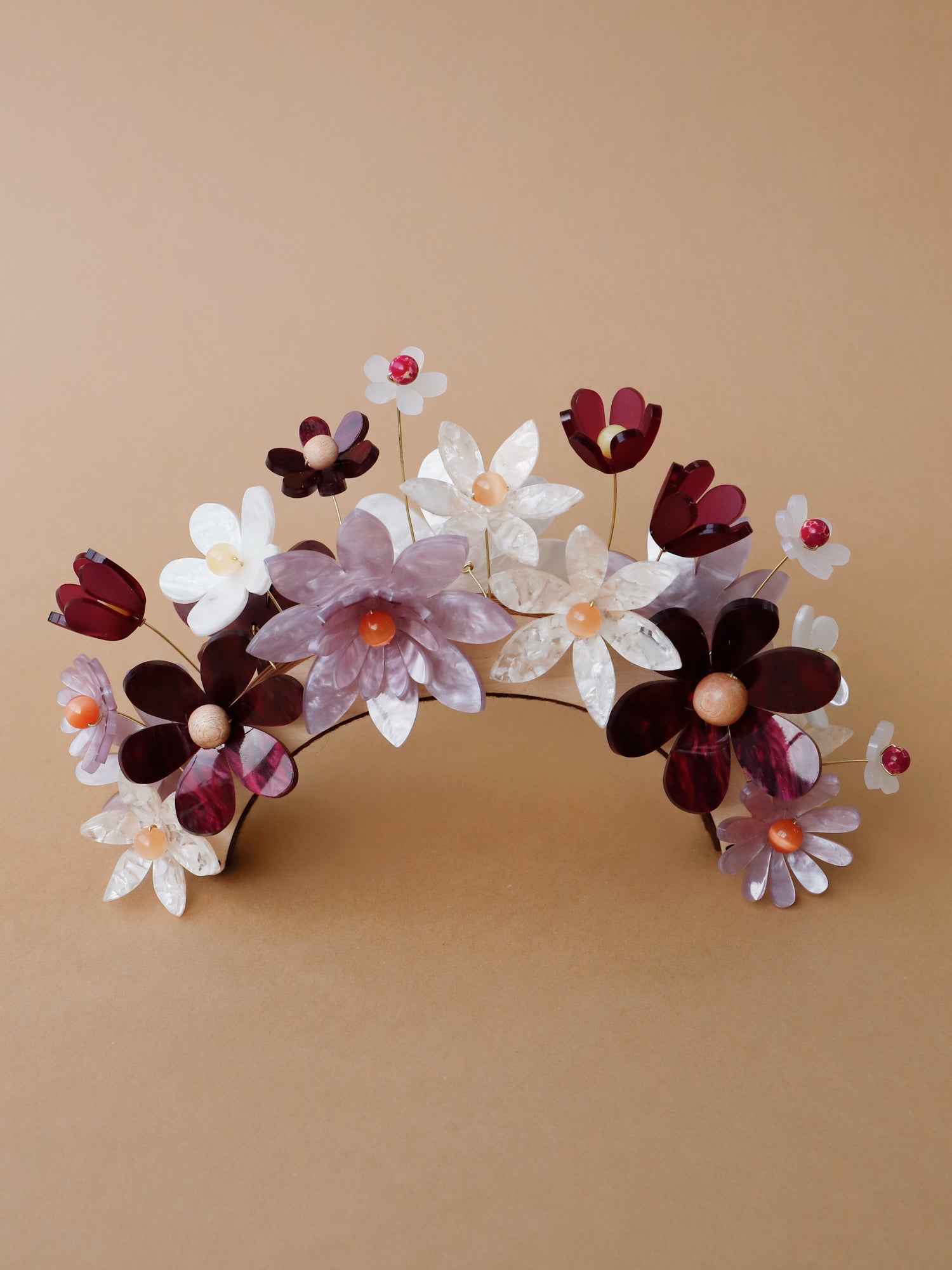 Hand-formed flower acrylic headpiece. Made from acrylic, FSC approved wood with gold-tone or black metal hair combs. Handmade in the UK by Wolf & Moon.