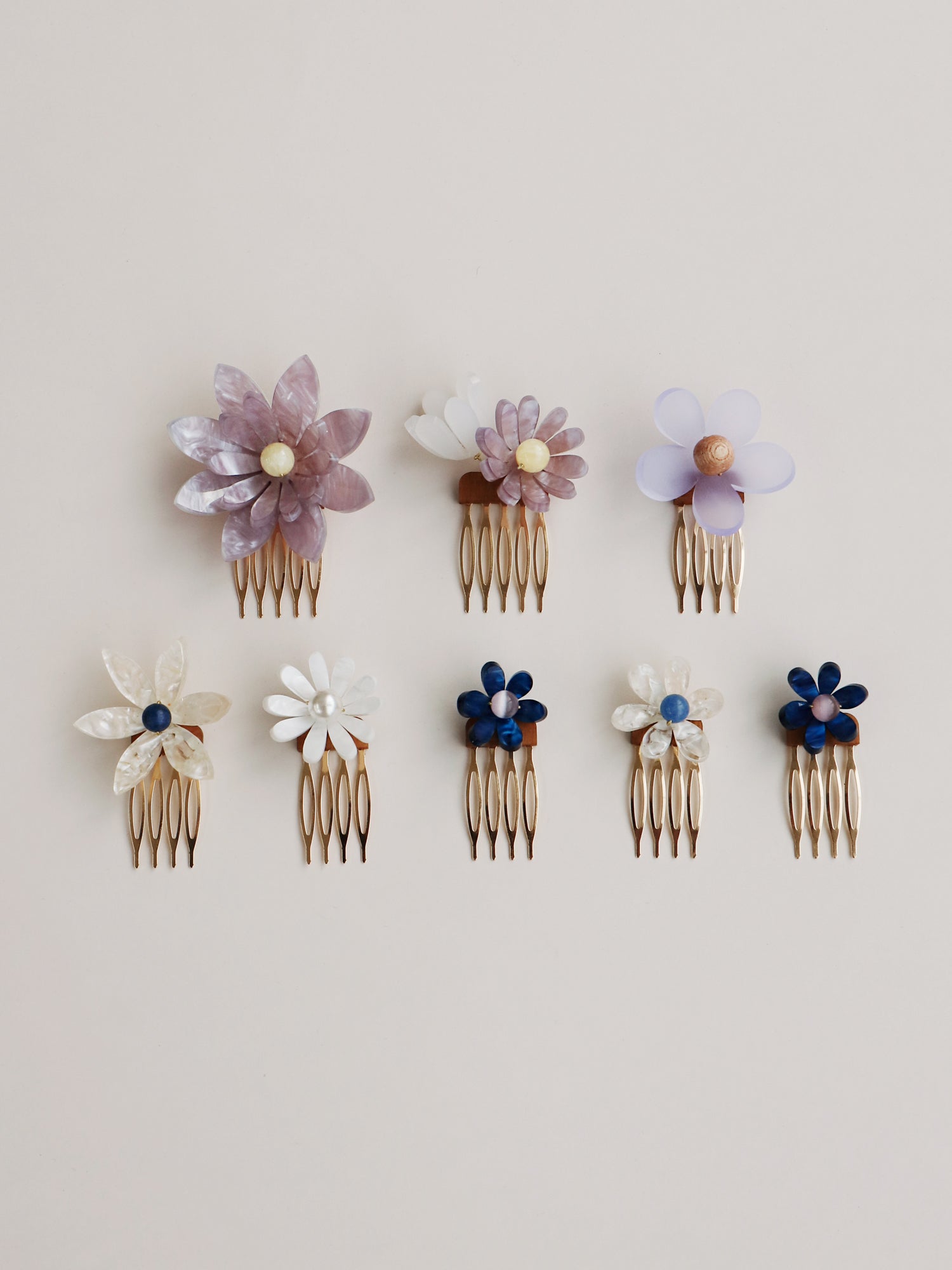 Hand-formed flower acrylic hair comb set. Made with acrylic and gold-tone or black metal hair combs. Handmade in the UK by Wolf & Moon.