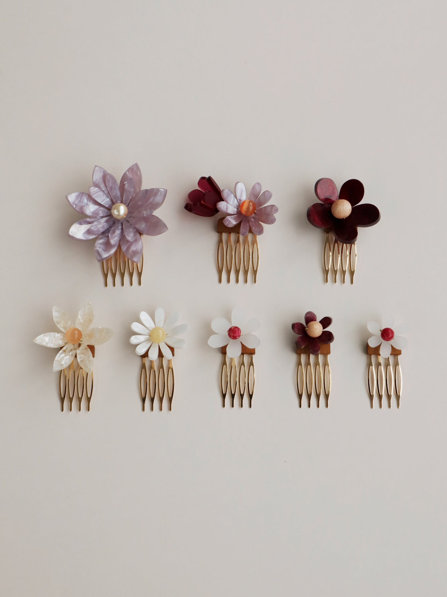 Hand-formed flower acrylic hair comb set. Made with acrylic and gold-tone or black metal hair combs. Handmade in the UK by Wolf & Moon.