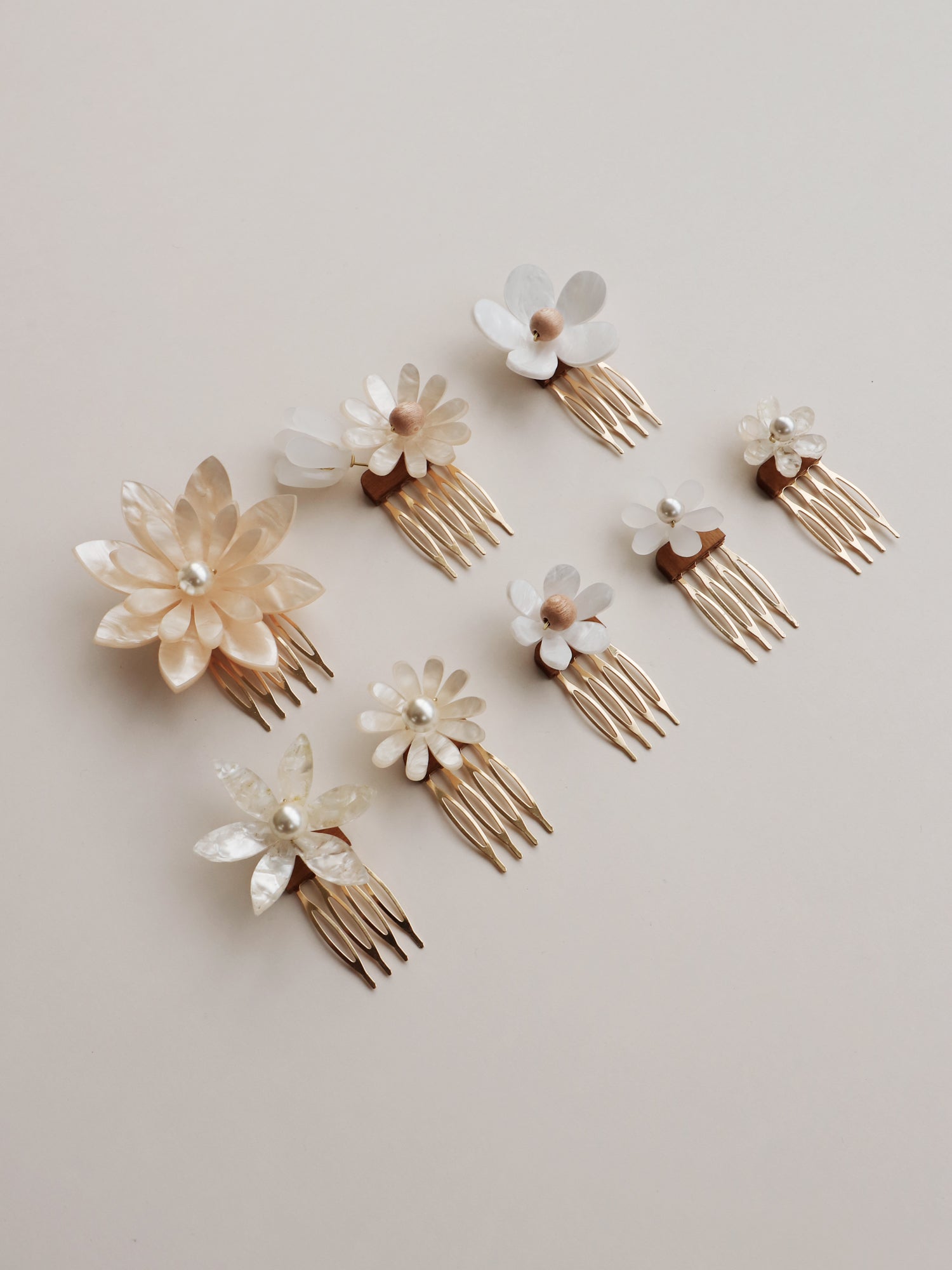 Hand-formed flower acrylic hair comb set. Made with acrylic and gold-tone or black metal hair combs. Handmade in the UK by Wolf & Moon.